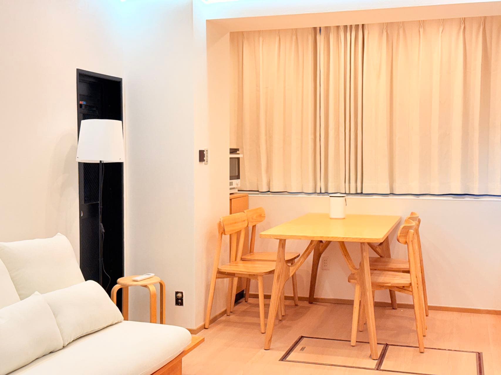 Compact dining area with warm curtains