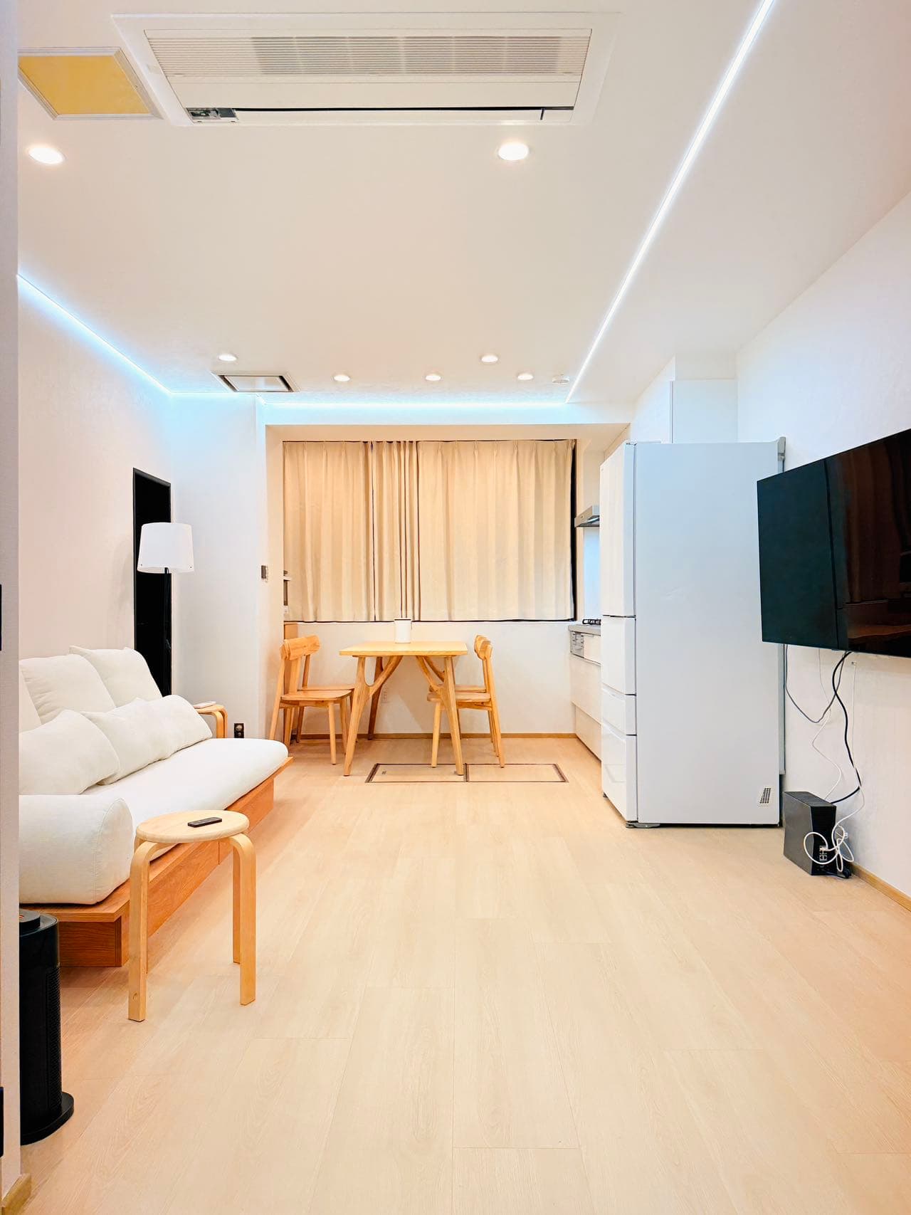 Homestay dining area and TV wall